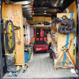the interior of a work van full of commercial electricians tools