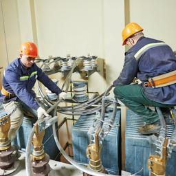 industrial electricians working with large wires